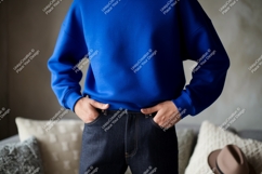Blue sweatshirt dark jeans casual outfit image Product Image 1