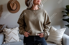 Woman wearing taupe sweatshirt jeans Product Image 1