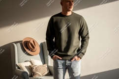 Man wearing green sweatshirt and jeans image Product Image 1