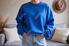 Blue sweatshirt light jeans cozy interior image Product Image 1