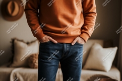 Orange sweatshirt blue jeans person Product Image 1