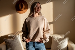 Woman wearing tan sweatshirt and blue jeans Product Image 1