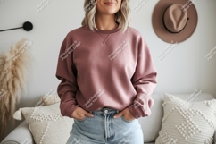 Woman wearing dusty rose sweatshirt and denim casual Product Image 1