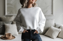 Woman wearing white sweatshirt and jeans image Product Image 1