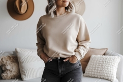Woman wearing beige sweatshirt and black jeans image Product Image 1