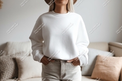 Woman wearing white sweatshirt and beige pants Product Image 1