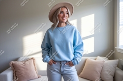 Woman wearing blue sweatshirt and hat light Product Image 1