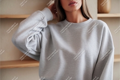 Woman wearing gray sweatshirt mockup Product Image 1