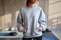 Woman in a grey sweatshirt mockup Product Image 1