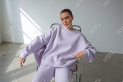 Woman in lavender sweatshirt mockup Product Image 1