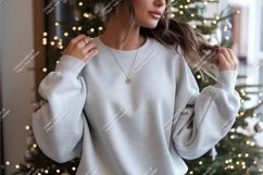 Woman poses in gray sweatshirt mockup Product Image 1