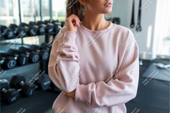 Woman in pink sweatshirt at gym mockup Product Image 1