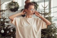 Woman poses by christmas tree mockup Product Image 1