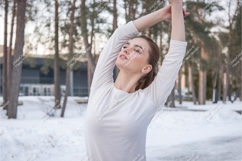 Woman stretching in winter park mockup Product Image 1