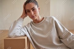 Woman in a beige sweatshirt mockup Product Image 1