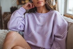 Woman in lilac sweatshirt on couch mockup Product Image 1