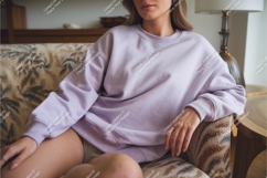 Woman in lilac sweatshirt on couch mockup Product Image 1