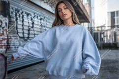 Woman in blue sweatshirt outdoors mockup Product Image 1