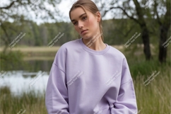 Woman in lavender sweatshirt mockup Product Image 1