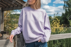 Woman in lilac sweatshirt outdoor mockup Product Image 1