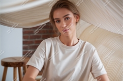 Woman in beige tshirt indoors mockup Product Image 1