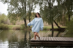 Woman on dock in sweatshirt mockup Product Image 1