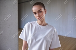 Woman in tshirt looking down mockup Product Image 1