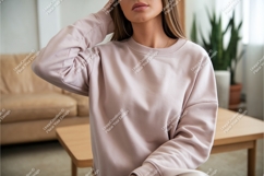 Woman in pink sweatshirt indoors mockup Product Image 1