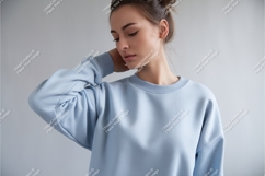 Woman in blue sweatshirt looking down mockup Product Image 1