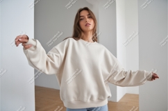 Woman in beige sweatshirt mockup Product Image 1