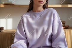 Woman in lilac sweatshirt indoors mockup Product Image 1
