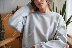 Woman in gray sweatshirt mockup Product Image 1