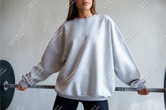 Gray sweatshirt mockup with barbell weightlifting Product Image 1