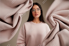 Format: Title: Woman wearing pink sweatshirt with fabric moc Product Image 1