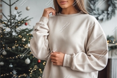 Format: Title: Woman wearing cream sweatshirt near Christmas Product Image 1