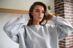 Young woman wearing grey sweatshirt casual fashion Product Image 1