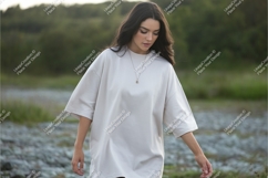 Woman wearing oversized t-shirt outdoors Product Image 1