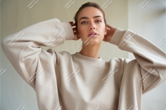Young Woman Wearing Beige Sweatshirt Mockup Product Image 1