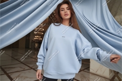 Woman wearing light blue sweatshirt fabric fashion Product Image 1