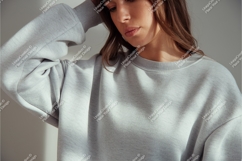 Woman wearing grey sweatshirt casual fashion Product Image 1
