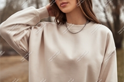 Woman wearing cream sweatshirt and necklace casual Product Image 1