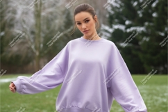 Woman wearing lavender sweatshirt outdoors nature Product Image 1