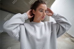 Woman wearing grey sweatshirt and glasses fashion Product Image 1