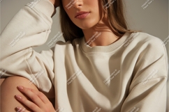 Woman wearing cream sweatshirt casual fashion Product Image 1