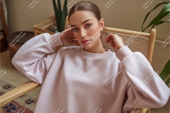 Young woman wearing pink sweatshirt casual fashion Product Image 1
