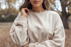 Woman wearing cream sweatshirt outdoors casual Product Image 1