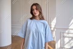 Woman wearing light blue t shirt apparel Product Image 1