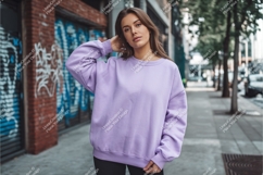 Young woman wearing lavender sweatshirt outdoors street Product Image 1