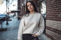 Woman wearing cream sweatshirt black jeans Product Image 1