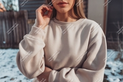 Woman wearing cream sweatshirt outdoors casual Product Image 1
